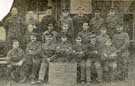 Group of British prisoners-of-war at Friedrichsfeld, Germany. The third man from the right, on the front row, is Private A. Dawes, of the York and Lanc. Regiment, a native of Gleadless, Sheffield. He joined the Army at the outbreak of war. 