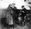 Sheffield Aviation Week - our picture shows Mr Tudor putting the leather cap upon the head of the first passenger who ascended yesterday