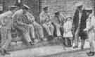 Group of soldiers at Hathersage Hospital making friends with one the children from the village