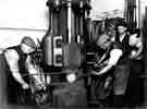 B. Huntsman Ltd., forging cast steel discs under power hammer, c. 1930