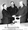 Mr L. Chapman presents Mr A. Mills with a radio subscribed for by staff at Jessop Saville Ltd, 31st December 1959.