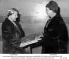 Mrs Brennan presents a box of chocolates to Mrs Hammond at Jessop Saville's Sports Club concert, 2 April 1960. Mrs Brennan presents a box of chocolates to Mrs Hammond at Jessop Saville's Sports Club concert, 2 April 1960.