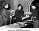 Mrs Pauline Howe presents a bouquet to Mrs Wallace and Mrs Hammond on behalf of Jessop Saville Ltd. Mrs Pauline Howe presents a bouquet to Mrs Wallace and Mrs Hammond on behalf of Jessop Saville Ltd.