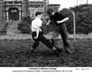 Playing football outside William Jessop and Son Ltd's Whiston Grange Research Centre, c. 1950