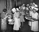 School meals; portions being served in readiness for dinner School meals; portions being served in readiness for dinner