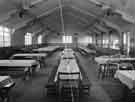 School meals; tables laid for dinner in school dining room