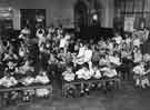 School meals; infant children dining in a school hall 