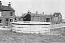 Broad Oaks, Darnall showing a typical covered concrete tank (sunk 3 feet in the ground) holding 12,000 gallons of drinking water for public emergency use
