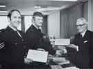 The Chairman of the Police Authority, County Councillor E. Fox, JP, presenting Sergeant Scothern and Constable Ford with certificates from the Society for the Protection of Life from Fire - April, 1977