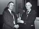 South Yorkshire Police: Deputy Chief Constable, Mr C. F. Gutsell, QPM, (left) presenting Bill Pettigrew an award for outstanding service to the Sports and Social Club