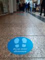 Covid-19 pandemic: Meadowhall Shopping Centre, Keep your distance floor sign Covid-19 pandemic: Meadowhall Shopping Centre, Keep your distance floor sign