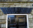 Carved details above doorway of No. 6 Clarke Dell formerly Grove