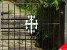 Iron work inspired by the family crest of the Stabler family on the gate of 42 Westbourne Road
