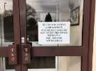 Covid-19 pandemic: Sign at entrance to T. and C. Williams (Builders) Ltd., Nos. 5 - 11 Norton Lees Lane