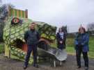 Councillor Bob Johnson, Councillor Mary Lea and Christine Welburn (Friends of Hillsborough Park) stand next to a giant snake head slide at Hillsborough playground