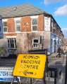 Covid-19 pandemic: sign for vaccination centre, Cemetery Road