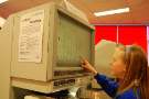 Child using the microfilm readers at Sheffield City Archives, Shoreham Street