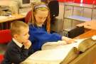 Children looking at a register at Sheffield City Archives, Shoreham Street
