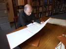 Archives Assistant, Graeme Siddall, viewing a manuscript, Sheffield City Archives, No. 52 Shoreham Street