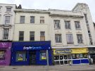 Shops on Haymarket showing (left) No. 17 Boyle Sports, bookmakers and (right) Nos. 19 - 21 Heron Foods, discount supermarket Shops on Haymarket showing (left) No. 17 Boyle Sports, bookmakers and (right) Nos. 19 - 21 Heron Foods, discount supermarket