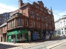 Shops in the Refuge Assurance Building, Church Street at the junction of (left) Orchard Street showing No. 35 Deli-Shuss, sandwich shop and Nos 37 - 39 Up and Running, sports clothes supplier Shops in the Refuge Assurance Building, Church Street at the junction of (left) Orchard Street showing No. 35 Deli-Shuss, sandwich shop and Nos 37 - 39 Up and Running, sports clothes supplier