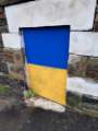 Brickwork painted in the colours of Ukraine at the junction of Carter Knowle Road and Ecclesall Road