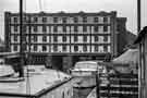Boats at the quayside looking towards the Straddle Warehouse, Sheffield Canal Basin (later Victoria Quays)