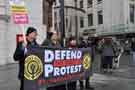 Banner at the demonstration against Racism and in support of refugees, Tudor Square showing (back right) the rear of the Central Library