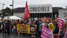 Banners at the demonstration against Racism and in support of refugees, Tudor Square showing (back) the Crucible Theatre