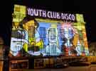 Light show projecting Pete McKee art work onto the Central Library, Tudor Square