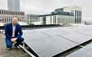 Councillor Ben Miskell, Chair of Sheffield City Council's Transport, Regeneration and Climate Policy Committee with solar panels launching the Sheffield Climate Investment