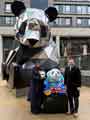 The Chinese Consul General from the Manchester Consulate, Tang Rui, presenting the Lord Mayor of Sheffield, with a panda statue on behalf of Chengdu City Government