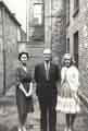 Margaret Sanderson, Mr Bramall and Doris [outside the offices of] Joshua Wortley Accountants, Paradise Square