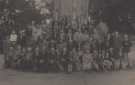 View: arc06041 Sheffield Channel Islands Society outing to Ilam, Staffordshire, with members pictured at the foot of Ilam Cross, [c. 1944]