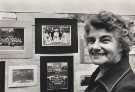 Woodhouse Wesleyan Methodist Church Centenary Flower Festival, showing Dorothy Hardcastle in front of display of old photographs connected with the church exhibited in the schoolroom, 8 Sep 1978