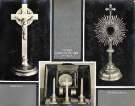 Crucifix (left), pocket communion set in case (centre) and monstrance (right) made by Walker and Hall Crucifix (left), pocket communion set in case (centre) and monstrance (right) made by Walker and Hall