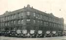 Premises of Nichols and Co. (Sheffield) Ltd, Wholesale Grocers and Tea, Coffee and Fruit Merchants, Shalesmoor (on corner with Shepherd Street), Sheffield, with motor lorries parked outside, [late 1930s]