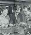 Batchelors Foods Ltd., Mostyn Staniforth, aged 16, apprentice electrician at the Sheffield factory demonstrates machines to his parents at the Regional Training Workshop, Port Sunlight, Cheshire