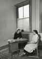 Unidentified matron talking to staff member, Barbara McReynolds Unidentified matron talking to staff member, Barbara McReynolds