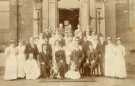 Mr and Mrs Burgess (front row seated) outside clock tower, City General Hospital (later known as the Northern General Hospital), Fir Vale