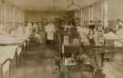 Block 5 hospital ward, City General Hospital (later known as the Northern General Hospital), Fir Vale showing (centre) Dr. [William] Brander. c.1930s