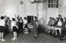 Nurses with patients during exercise session, probably School of Physiotherapy, Westbourne [House], Collegiate Crescent