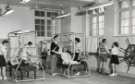 Nurses with patients during exercise session, probably School of Physiotherapy, Westbourne [House], Collegiate Crescent