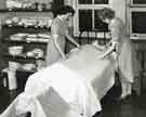 Bedmaking instruction - cornering, Clarke House School of Nursing, Clarke Drive Bedmaking instruction - cornering, Clarke House School of Nursing, Clarke Drive