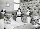 Nurses with masks attending a female patient, Clarke House School of Nursing, Clarke Drive Nurses with masks attending a female patient, Clarke House School of Nursing, Clarke Drive
