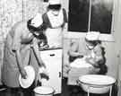 Bathing a baby showing two nurses under tuition, Clarke House School of Nursing, Clarke Drive Bathing a baby showing two nurses under tuition, Clarke House School of Nursing, Clarke Drive