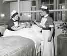 Nurse and sister attending a male patients, Clarke House School of Nursing, Clarke Drive Nurse and sister attending a male patients, Clarke House School of Nursing, Clarke Drive
