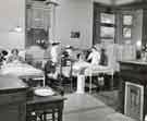 Sister and student nurses attending a patient, Clarke House School of Nursing, Clarke Drive Sister and student nurses attending a patient, Clarke House School of Nursing, Clarke Drive