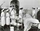 Sister and student nurses attending a patient, Clarke House School of Nursing, Clarke Drive