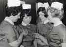 Nurses looking at their newly presented badges Nurses looking at their newly presented badges